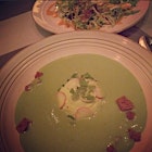 Chilled spring peas soup was poured over a dollop of pea cream, espellette pepper croutons, pickled pearl onions, at the table.