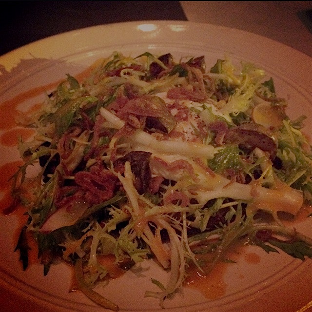 Chef Linton Hopkins' contribution to the menu, Johnny Cake dressed with radish, frisée lettuce, p...