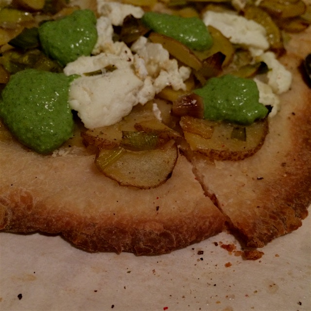 potato & leek pizza with sorrel pesto, ricotta, and whole wheat dough