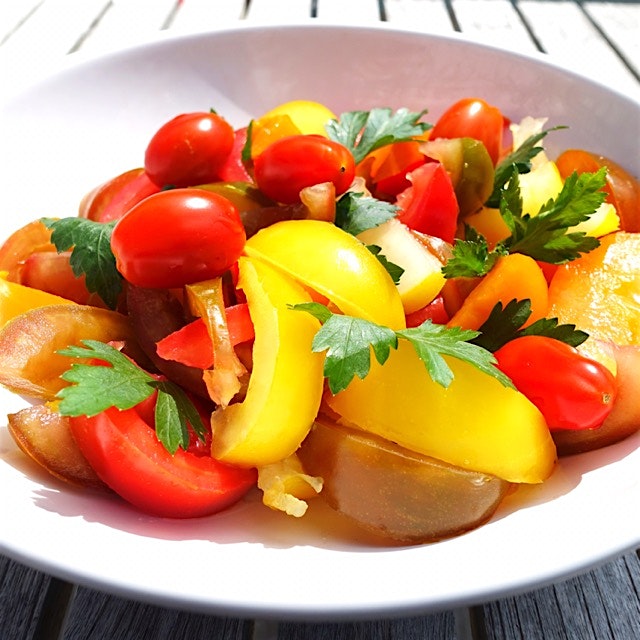 Colorful tomato salad with parsley