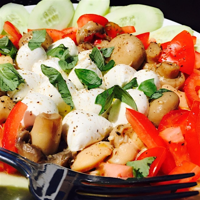 Whole milk mozzarella cheese Balls encompassed by tomatoes, cannelini beans, and cannelini beans....