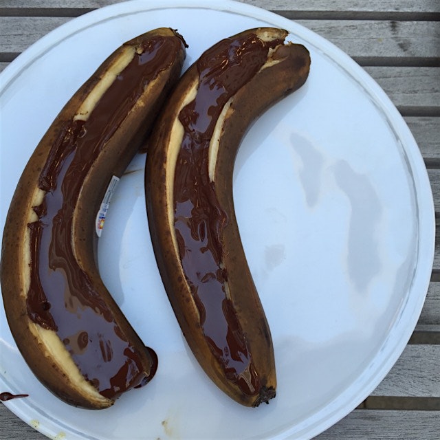 Lay banana flat & cut slit. Stuff with good #chocolate. Pop on grill till chocolate is melted. #i...