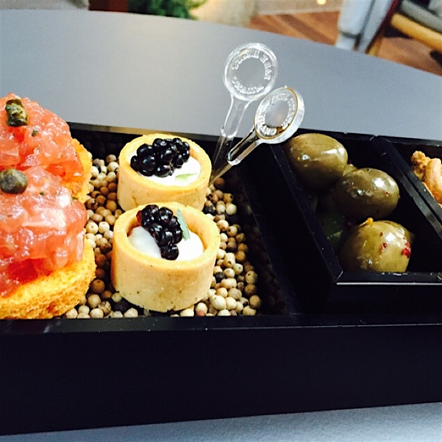 Served with my fancy Bloody Mary was tuna tartar on a tomato toast and blue cheese cup crackers w...