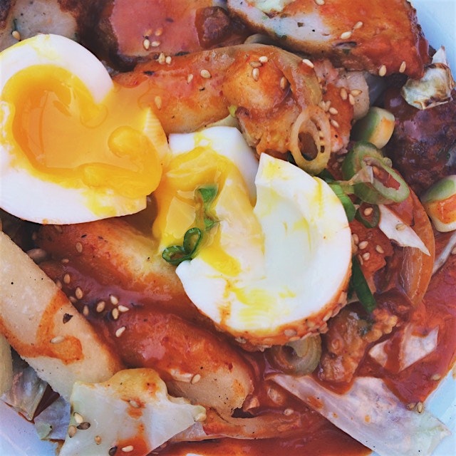 Spicy crispy rice cakes with fish cakes and an egg at Threes Brewing