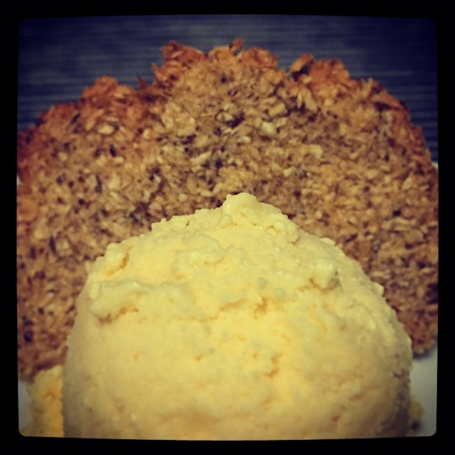 Coconut mango ice cream with a coconut tuile 