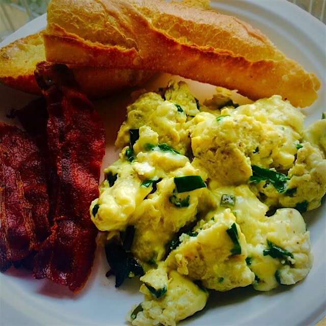 Scrambled eggs with ramps and aged cheddar, bacon, and baguette.  All thanks to Union Square Gree...