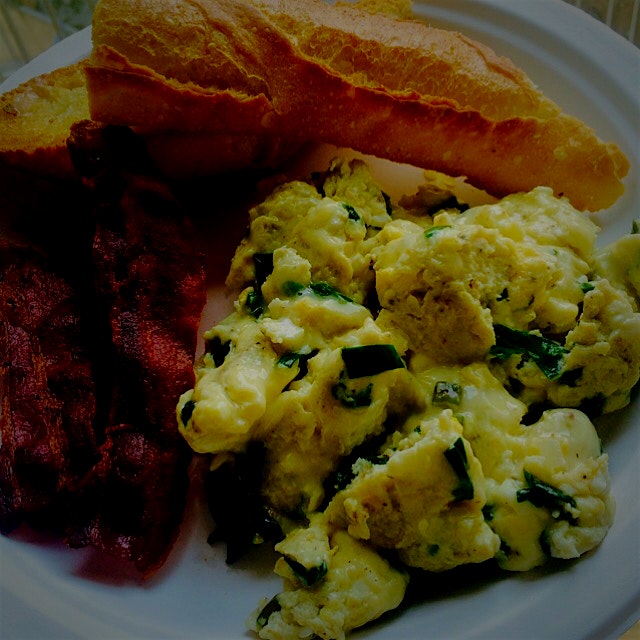 Scrambled eggs with ramps and aged cheddar, bacon, and baguette.  All thanks to Union Square Gree...