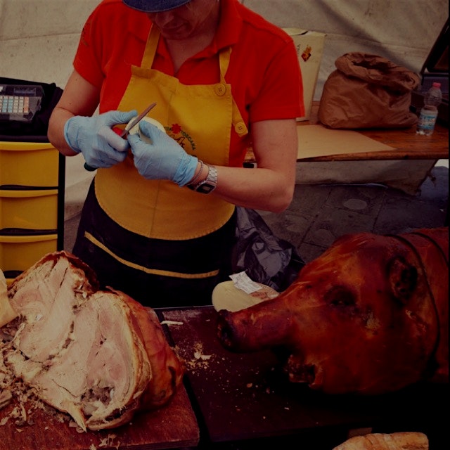 Fresh meat. This is how to eat lunch in Italy - just wander through the markets. One oink sandwic...