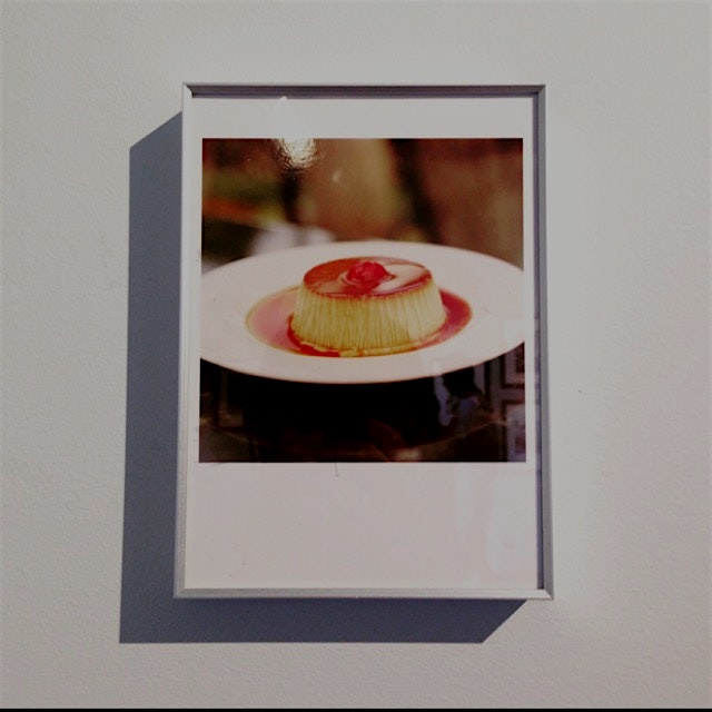 A photo of a photo of a delicious-looking flan. 
