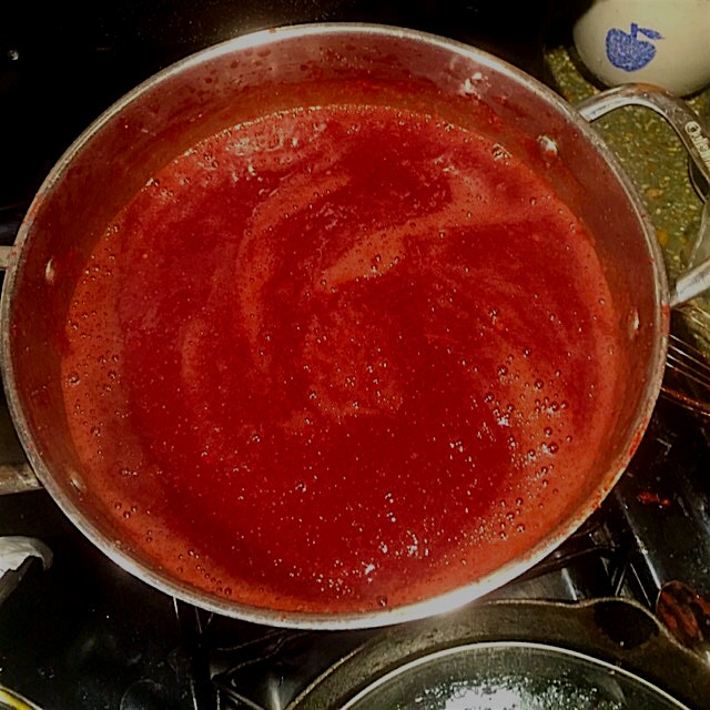 Strawberries, straight from the garden, simmering to jam perfection.