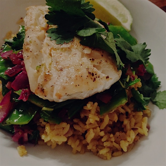 Pan-seared cod over curried basmati rice, snow peas, and mint 