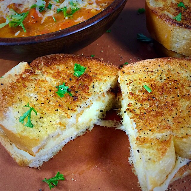 Grilled extra sharp cheddar cheese sandwich with homemade tomato soup for National Cheese Day.