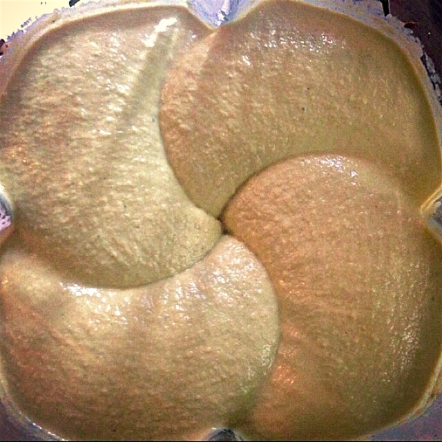 Hummus vortex made with fresh herbs from the garden. 