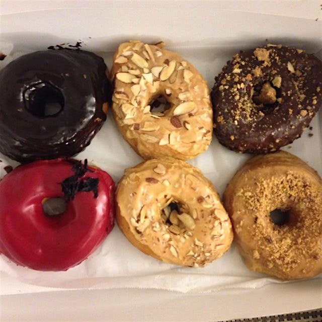 hibiscus, salted caramel, cafe au lait, mocha, and dulce de leche donuts from Dough in Brooklyn