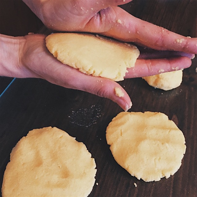 Covered in cornmeal making handmade arepas 👏🏻