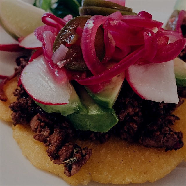 Arepas with ground beef, avocado & radishes with homemade pickled onions & jalapeños