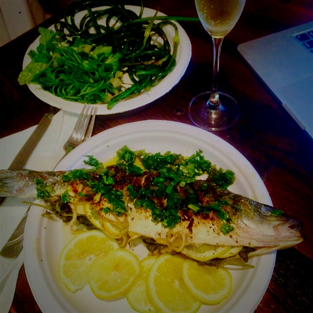 Finished product:  grilled sustainable Branzini with herb, garlic, and lemon gremolata, grilled g...
