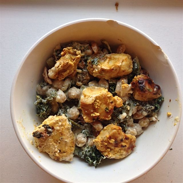 tissiyeh with kale and roasted peanuts, topped with broiled hyderabadi chicken. made by yours tru...