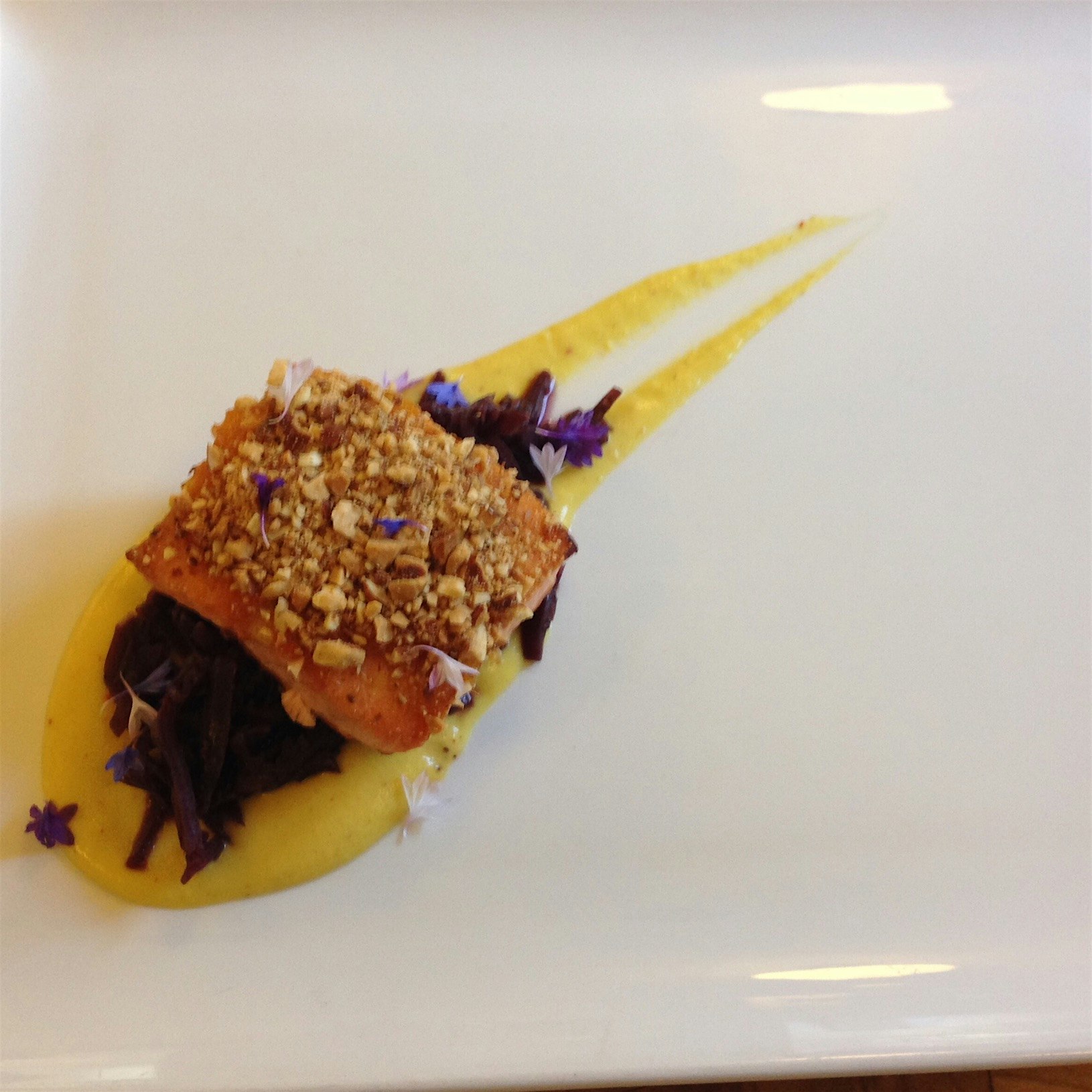 Wonderful wild caught Pacific salmon over a roasted corn purée and braised red cabbage, topped wi...