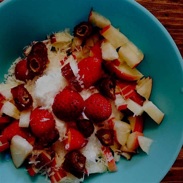 Hand-picked strawberries (by yours truly) with white peach, shredded coconut and dates over Greek...