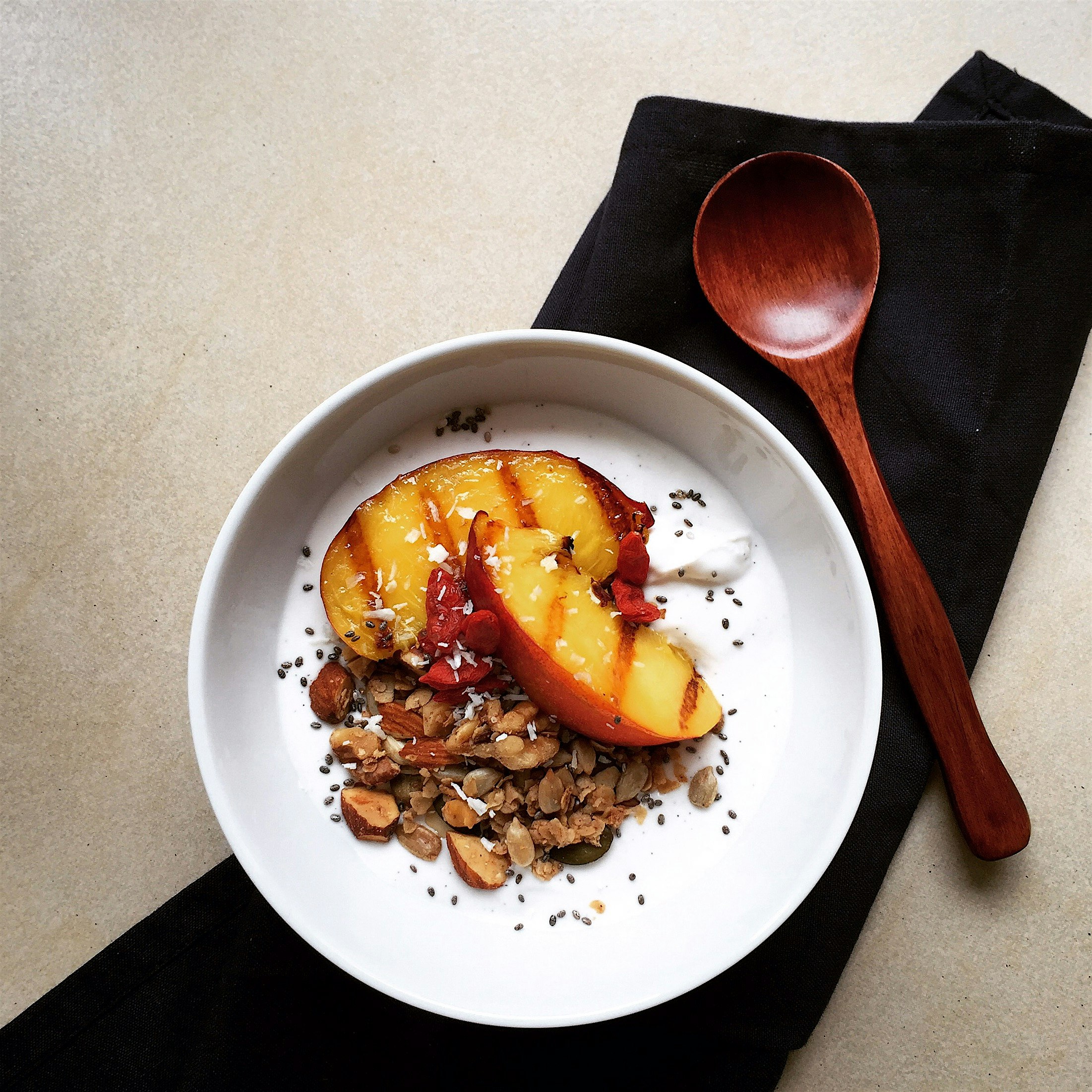 Grilled peach, homemade granola on coconut yogurt 