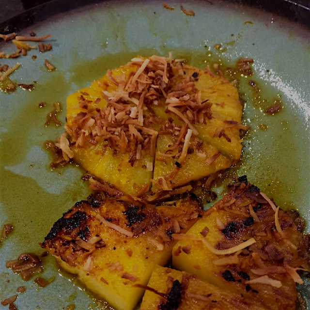 The last bites of rum-soaked, toasted-coconut-topped grilled pineapple #chaoscooking 