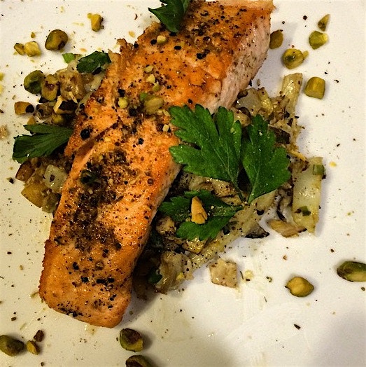 Dukkah-spiced salmon with spring vegetable and oyster mushroom ragout.