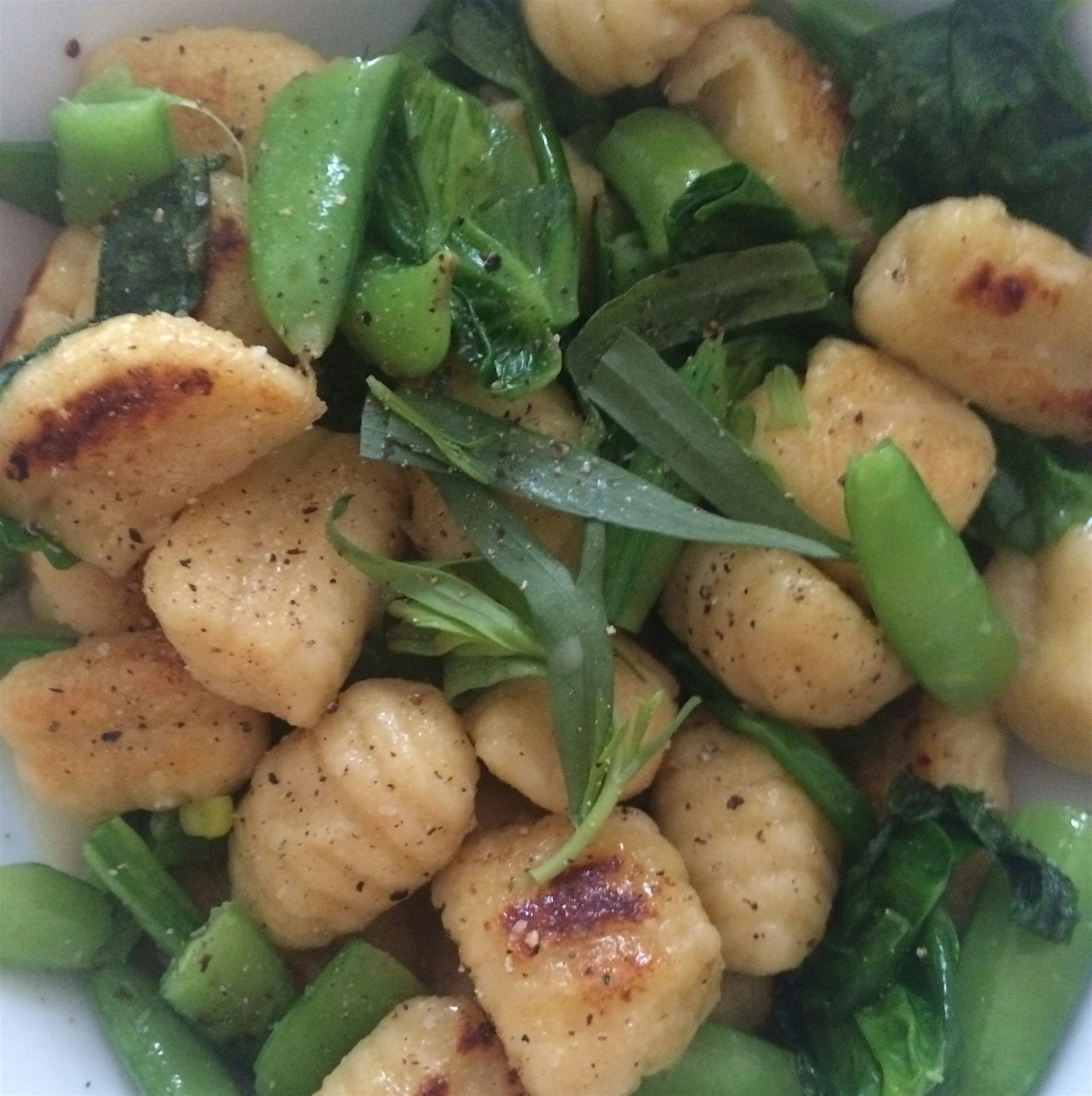 Spring pea gnocchi with Parmesan and garlic scape sauce.