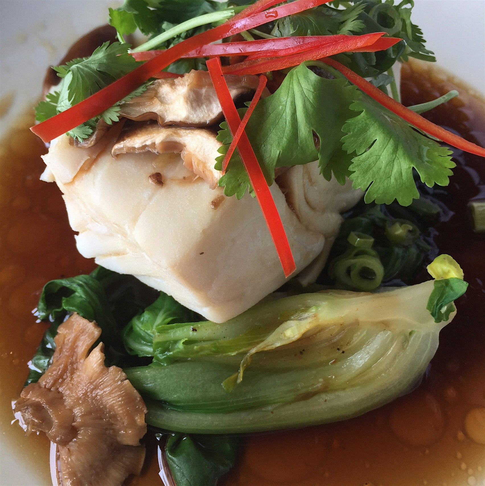 Steamed fish and veggies in an amazing simple broth of soy, sugar and water.