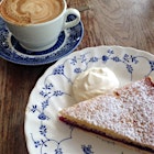 Happiness = a flat white & generous slice of bakewell tart. 