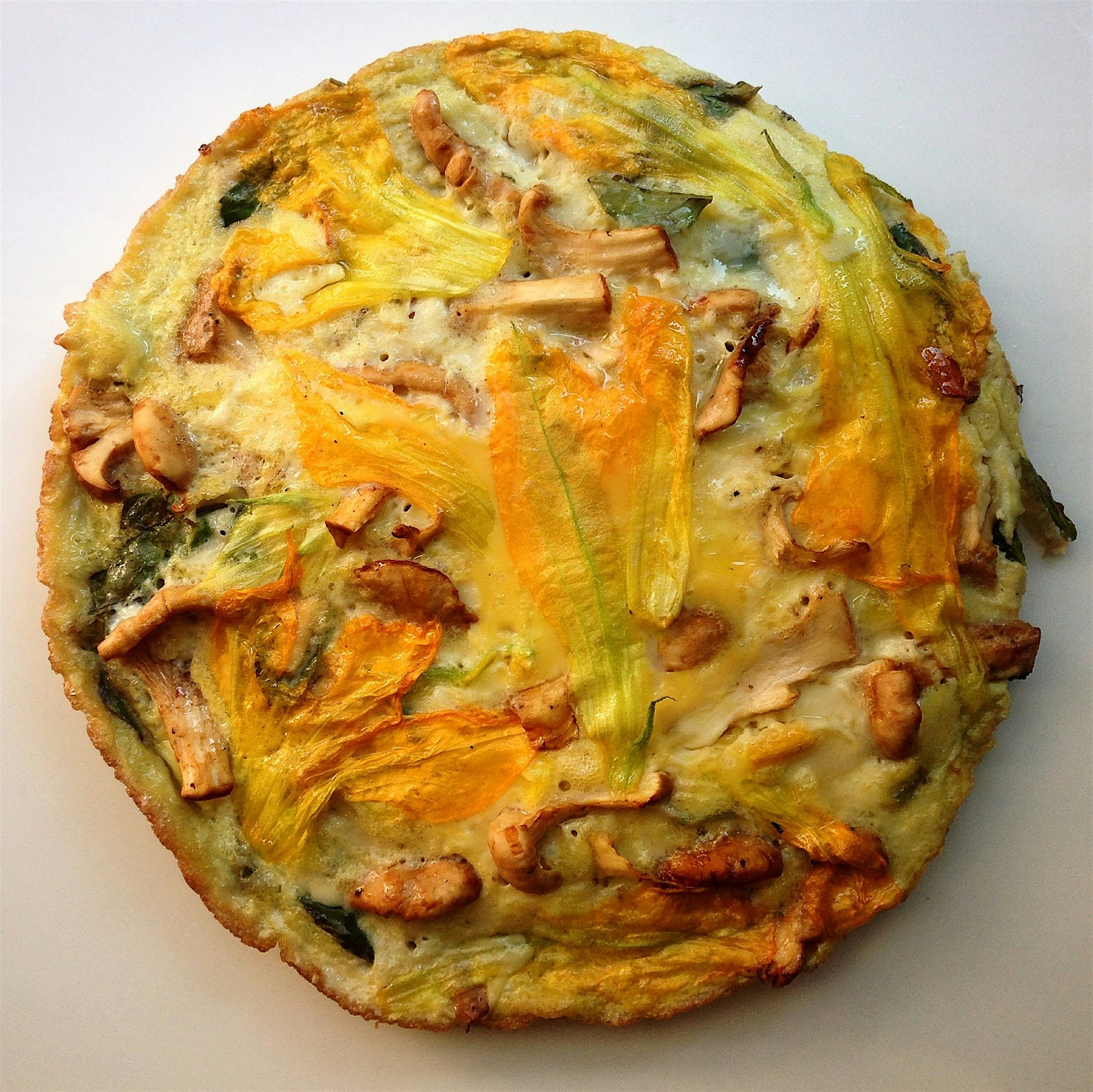 White chanterelle, basil & squash blossom egg pie. 