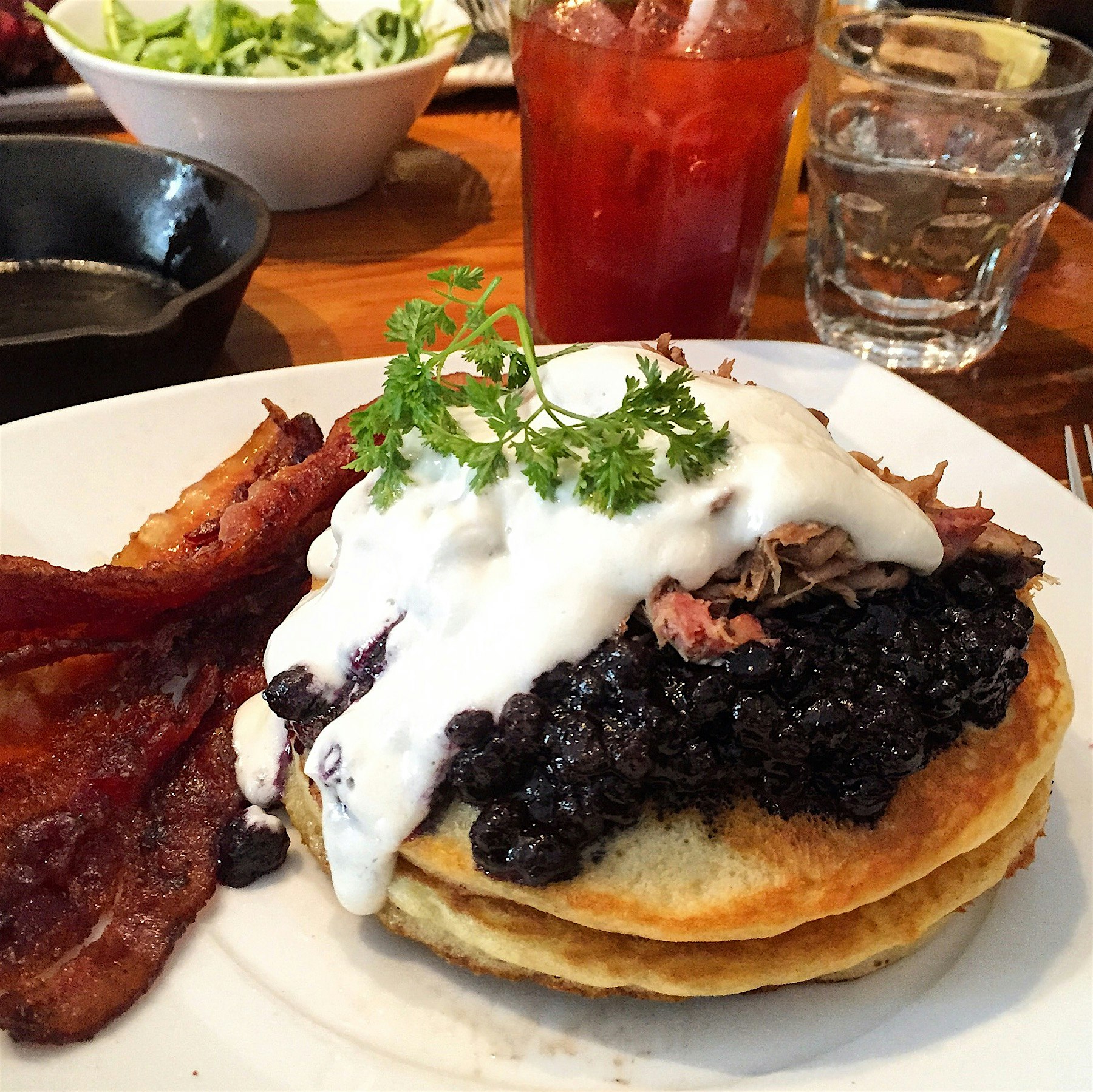 Sunday brunch in the city. Canadian classics: Bloody Caesar, maple syrup candied bacon, and panca...