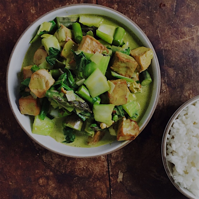 Green vegetable and tofu coconut curry flavored with Brooklyn Delhi roasted garlic achaar, cilant...