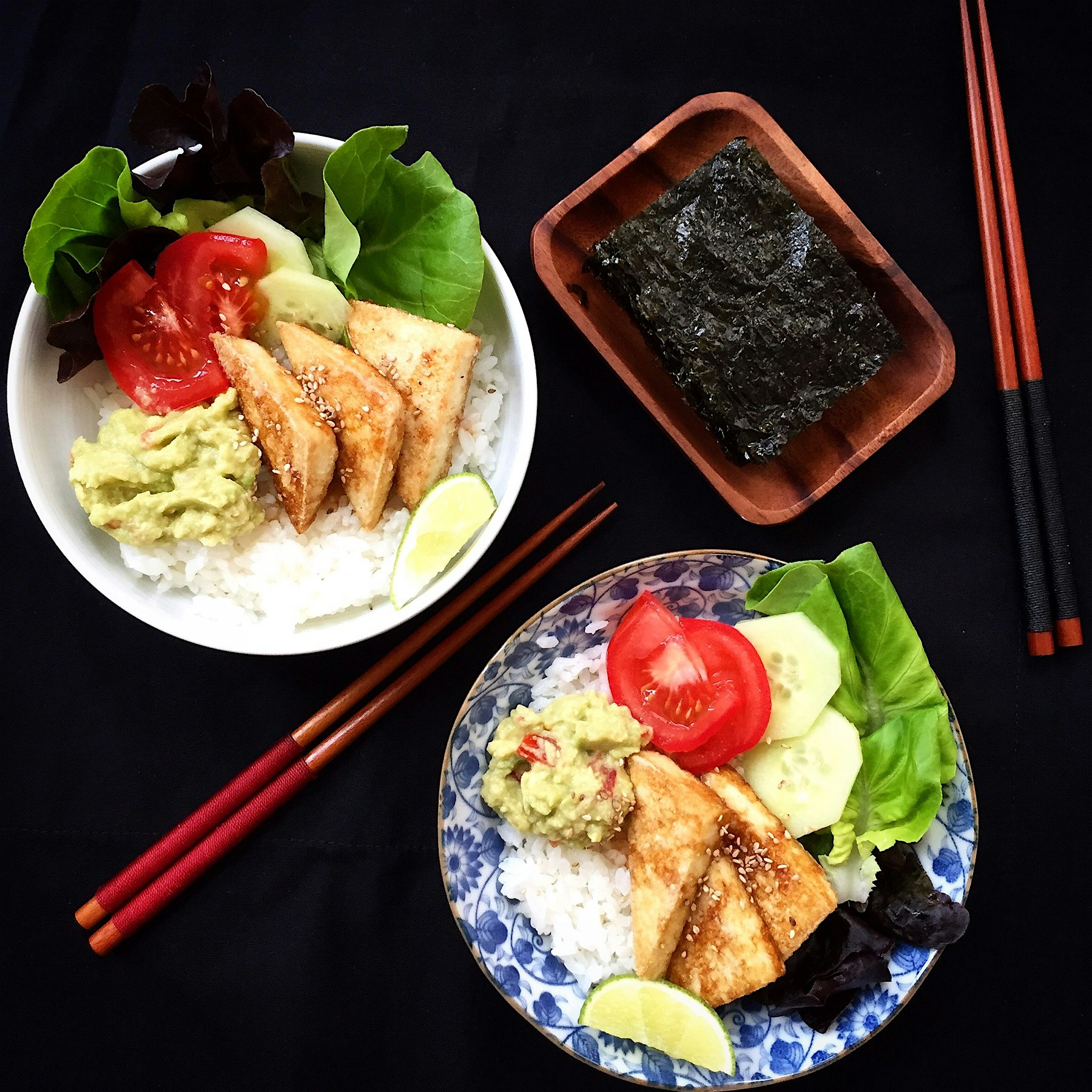 Rice bowl with tofu steaks, guacamole, salad and toasted nori seaweed