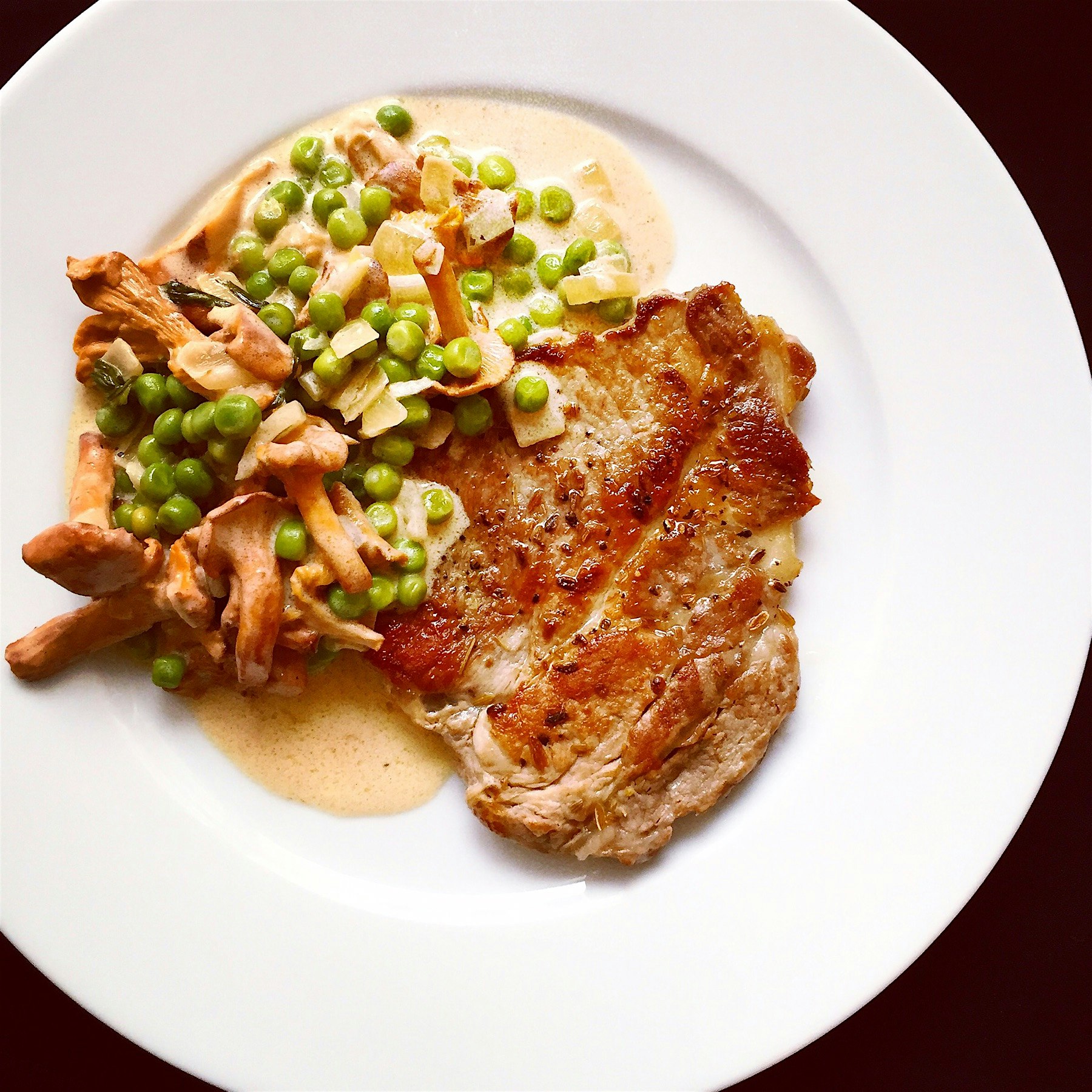 Pan-fried pork neck fillet seasoned with crushed fennel seeds, s&p. Served with creamy chanterell...