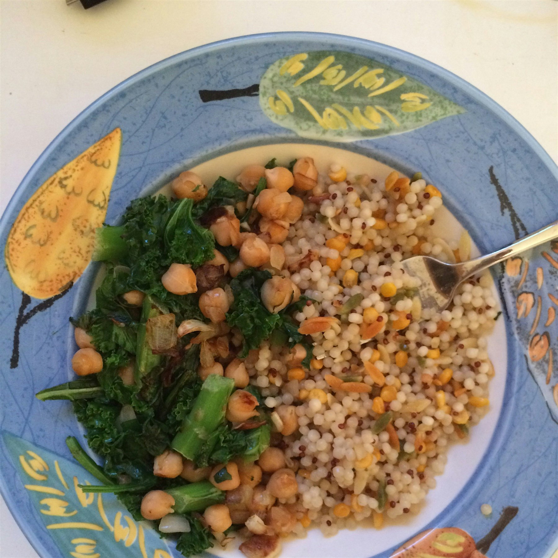 An old favorite from my first foray into living alone: coucous, garbanzo beans, kale, and spinach