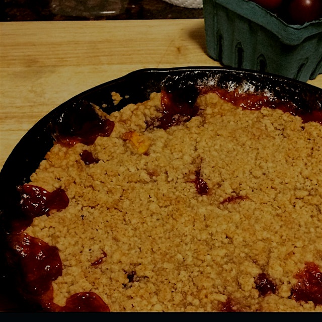 Peach Crumble made with fruit found at the farmers market. Perfect with some softly whipped cream.