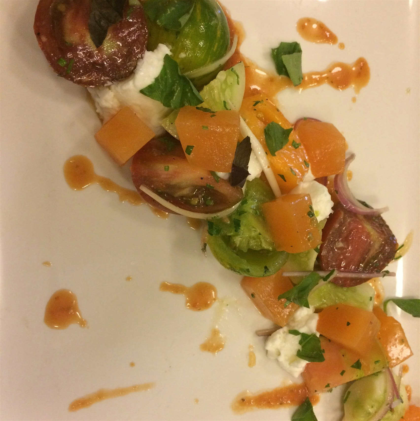 Tomato and melon salad with a smoked tomato vin and burrata sorbet. 