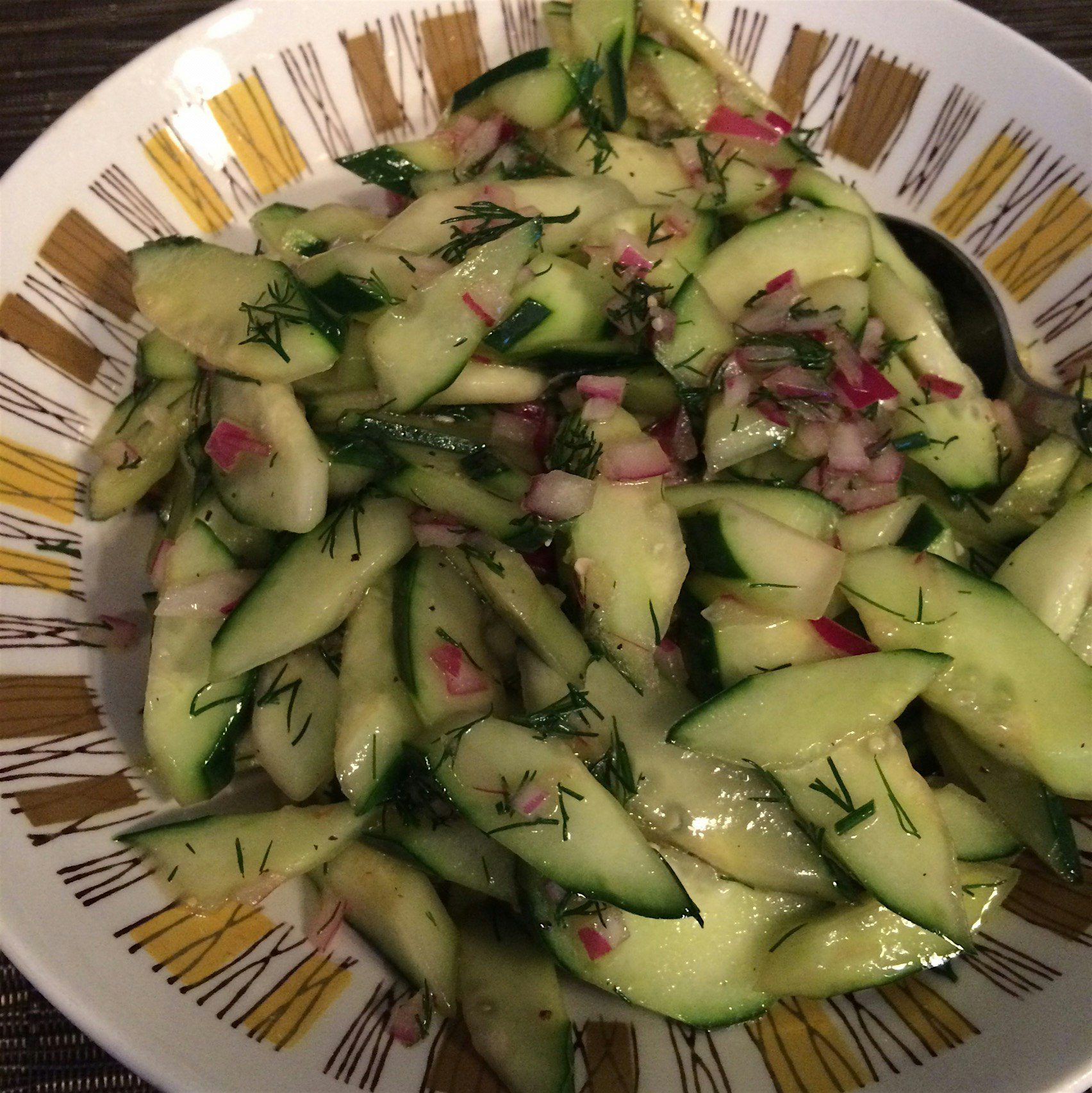 Dressed these garden cucumbers with fresh dill weed, a splash of red wine vinegar and olive oil f...