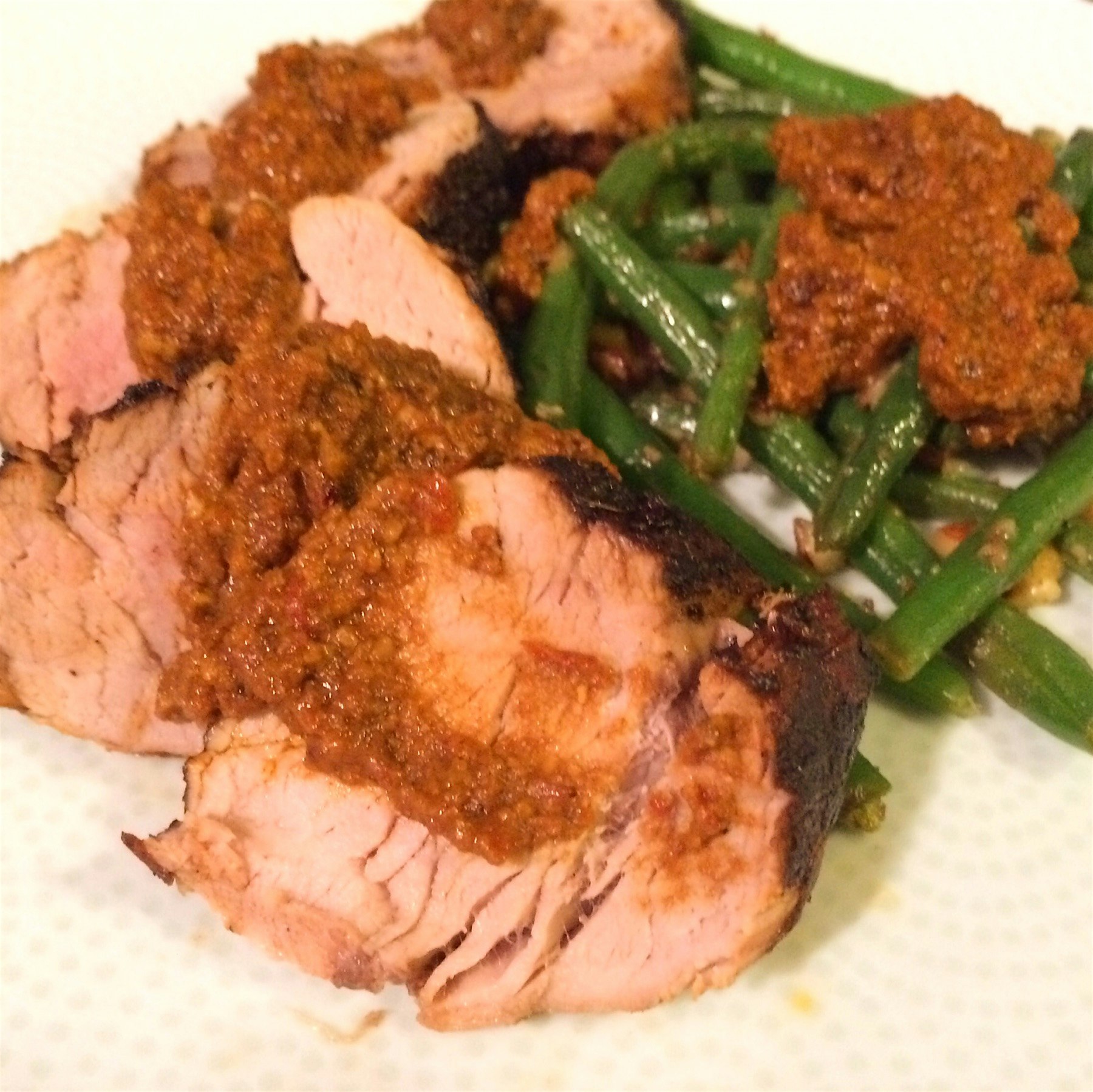 Coffee Rubbed Pork Tenderloin with Pan Jus, Green Beans and Romesco Sauce. Made at home. 