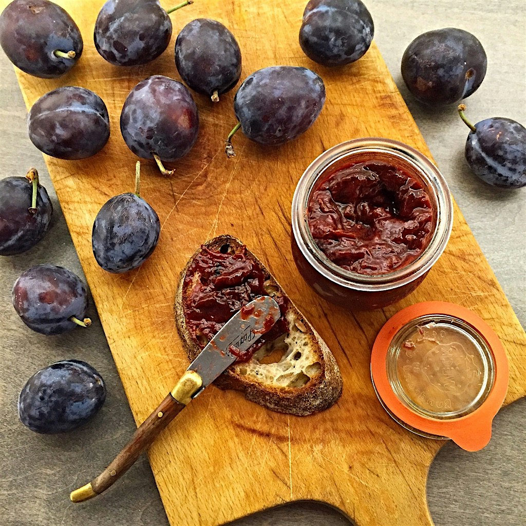 Plum butter ready for spreading on sourdough. 