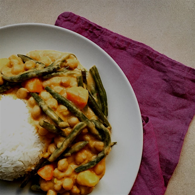 Meatless Monday dinner: green beans, potato and chickpeas massaman curry served with fluffy basma...