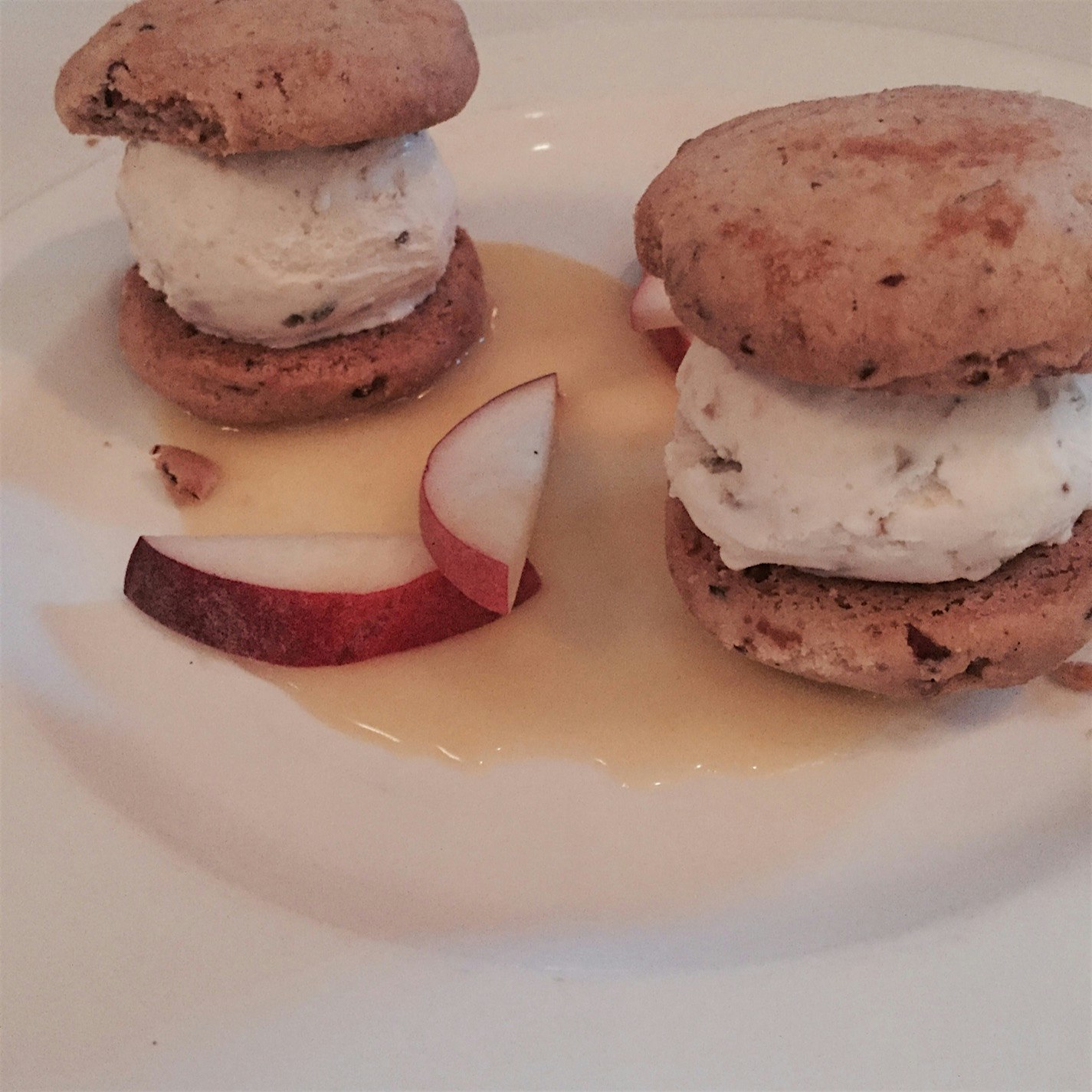 Pecan sandies stuffed with sunflower seed ice cream, on a lemon sauce with apple slices - perfect...