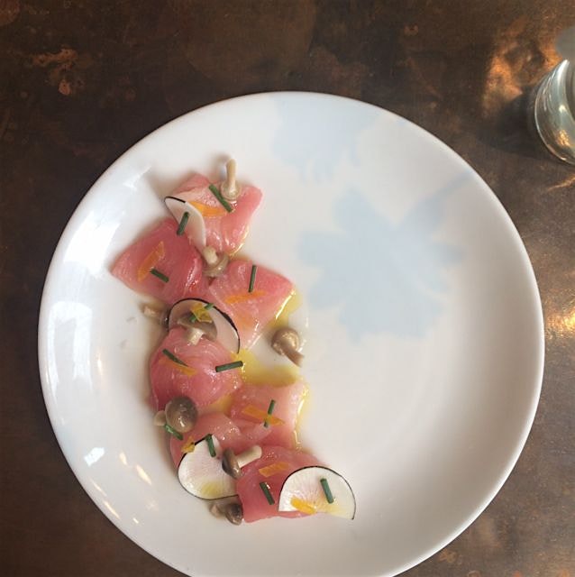 Hamachi crudo, pickled hon shimeji mushrooms, cured egg yolk, chives and black radish. @contradanyc