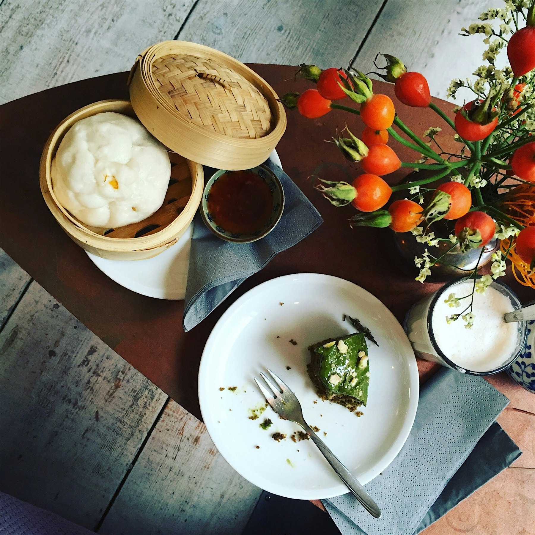 Matcha chocolate banana cake, steamed veggies bun, chai latte, gluten free heaven! At Charlie's A...