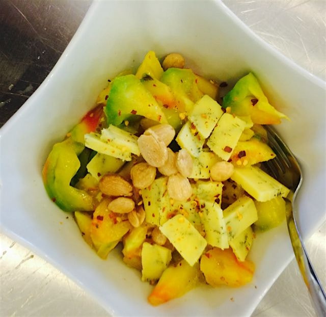 Taste the rainbow- heirloom tomato that is - topped with cheddar, chili flakes, and almonds. Farm...