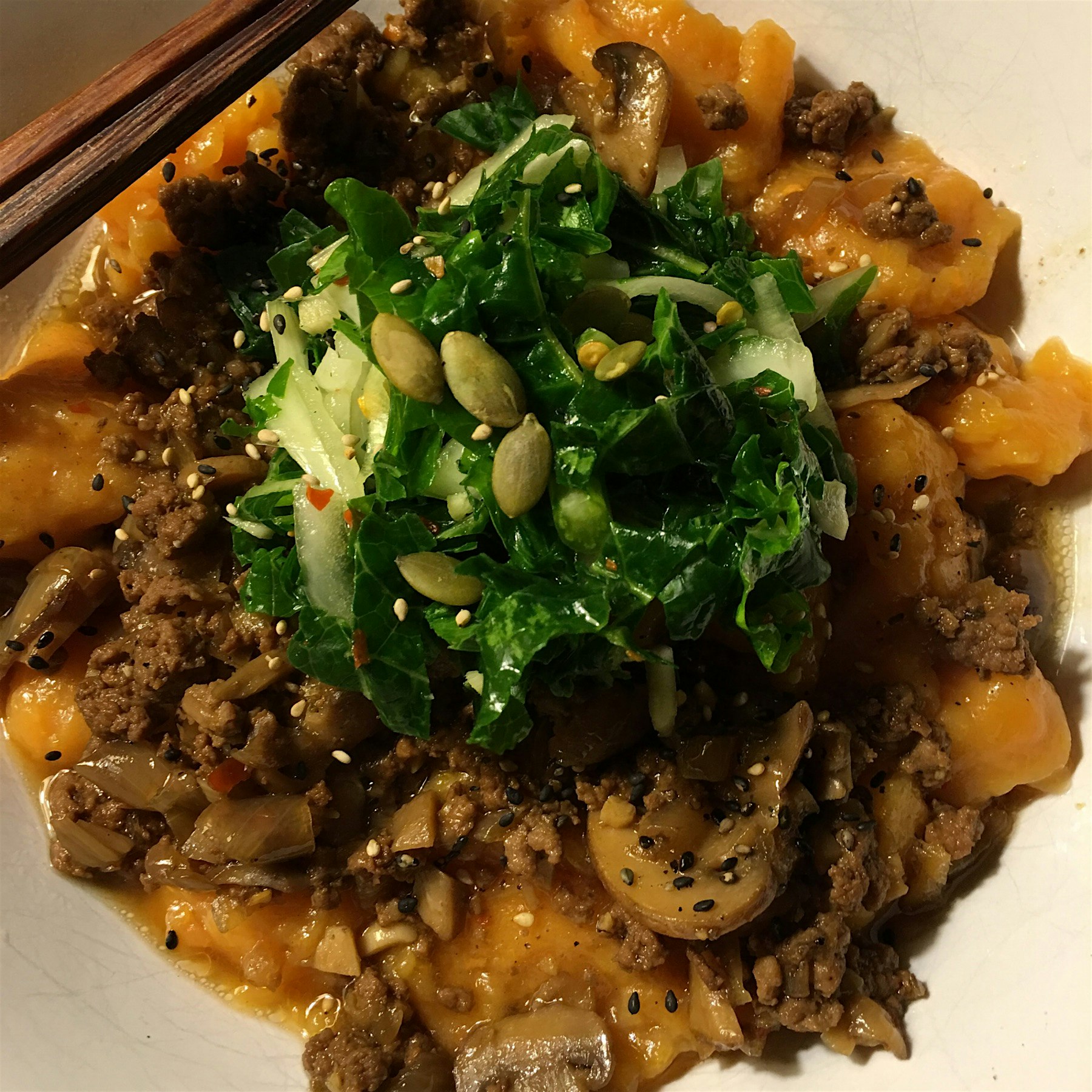 Sweet potato dumplings with Taiwanese meat and mushroom sauce and quick-pickled kale