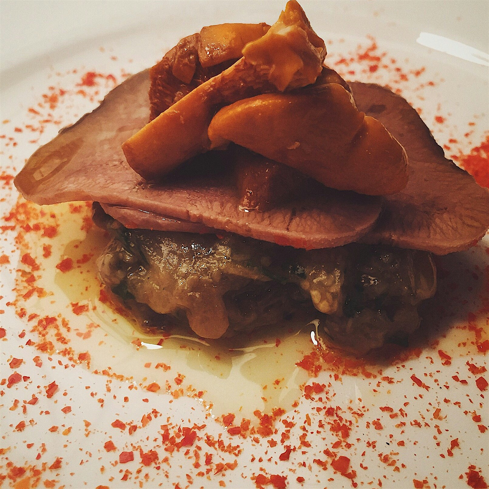 Smoked beef tongue with eggplant Confit and pickled chanterelles. 
