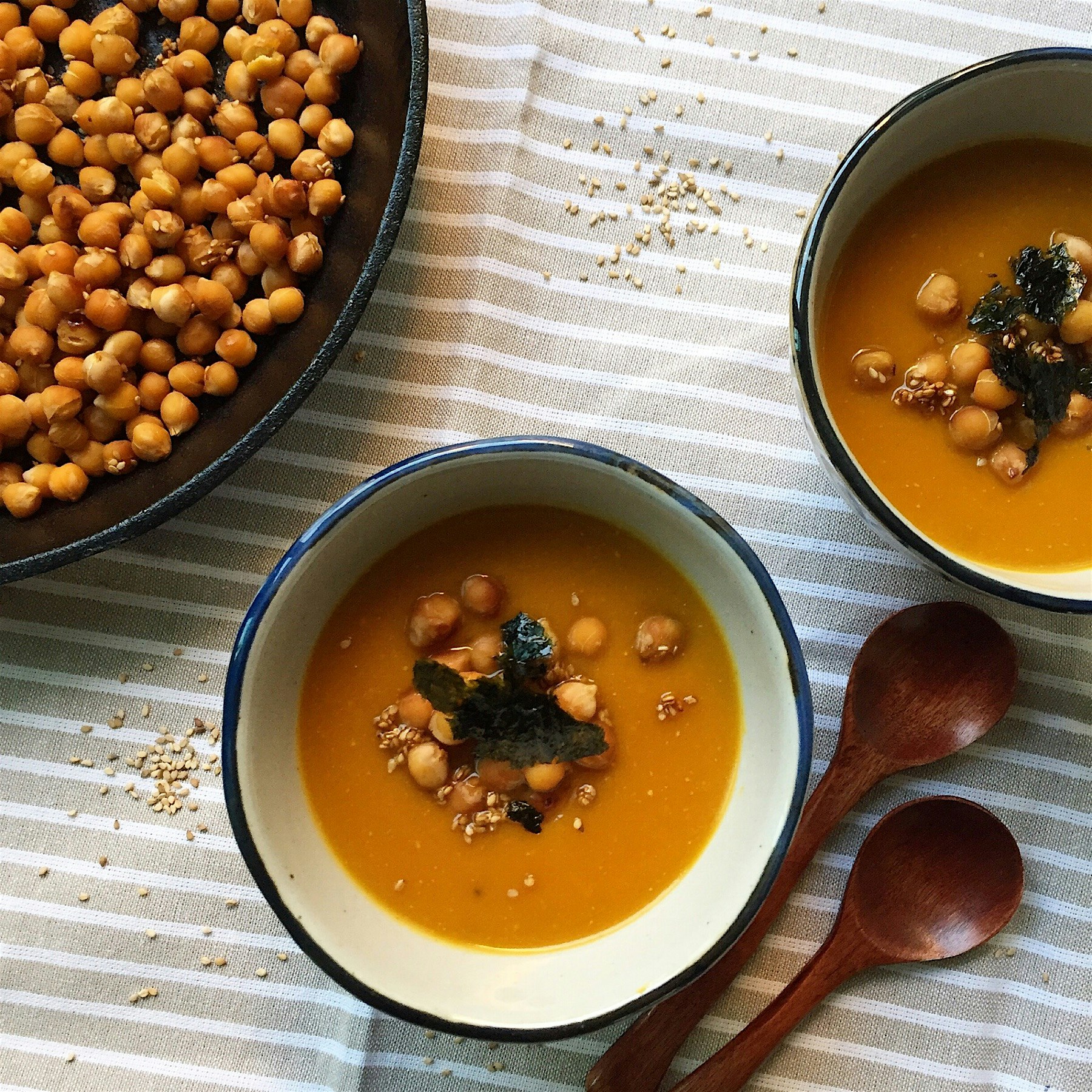 Miso roasted hokkaido pumpkin and carrots soup, topped with Tamari honey sesame chickpeas and cru...