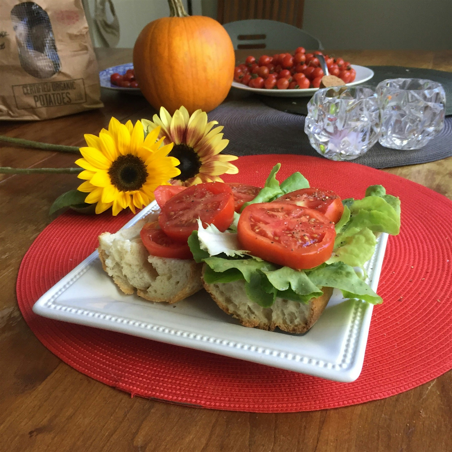 Maybe the last tomato sandwich of the season? From #mxmorningstarfarm with flowers from #tinyhear...